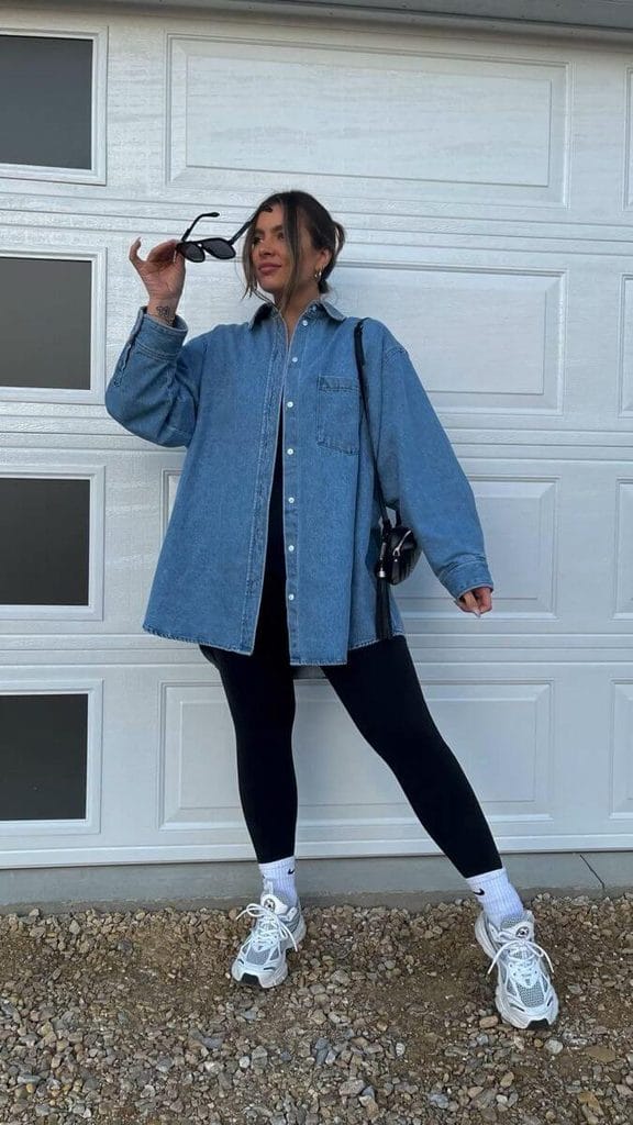 Shacket outfit ideas featuring a blue denim shacket with black leggings and white sneakers.