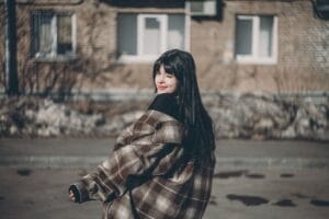 Woman wearing a brown plaid shacket for shacket outfit ideas, how to style a shacket