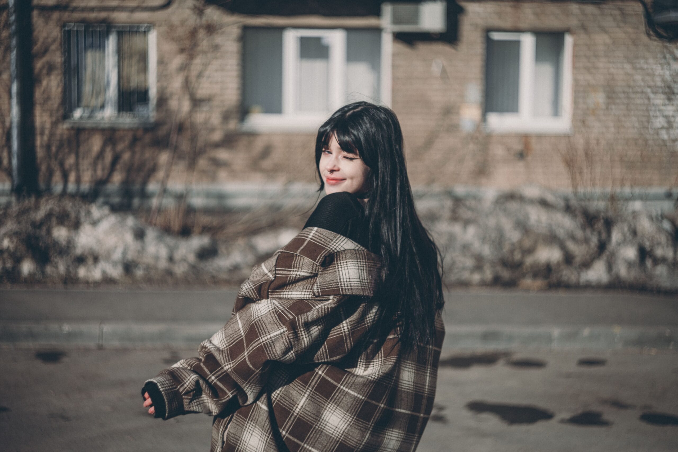 Woman wearing a brown plaid shacket for shacket outfit ideas, how to style a shacket