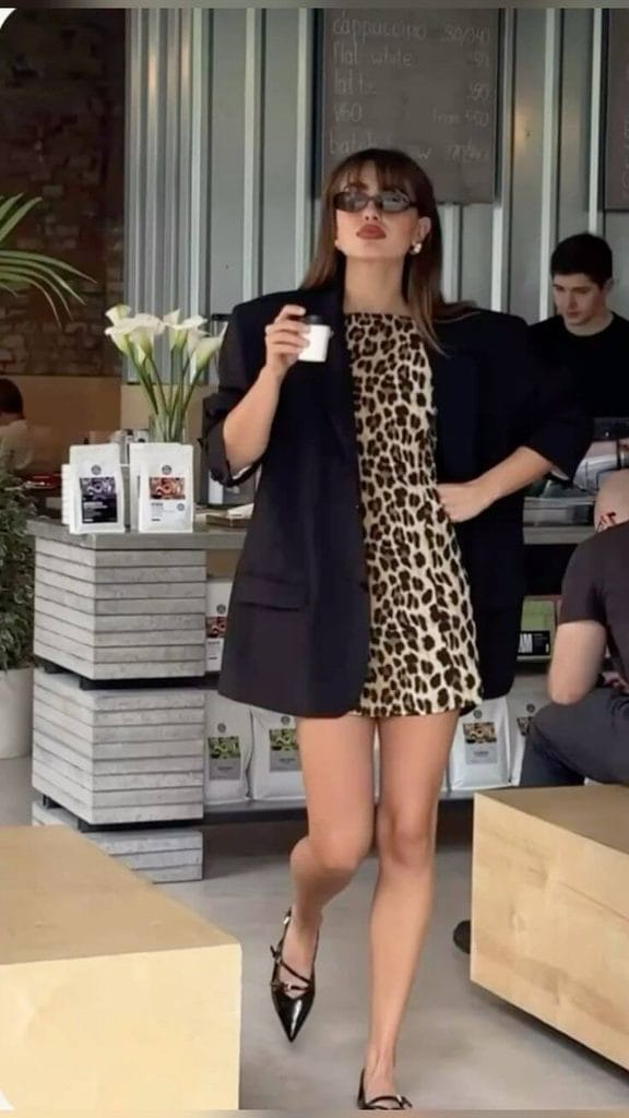 How to style an animal print dress with a black blazer for a chic outfit.
