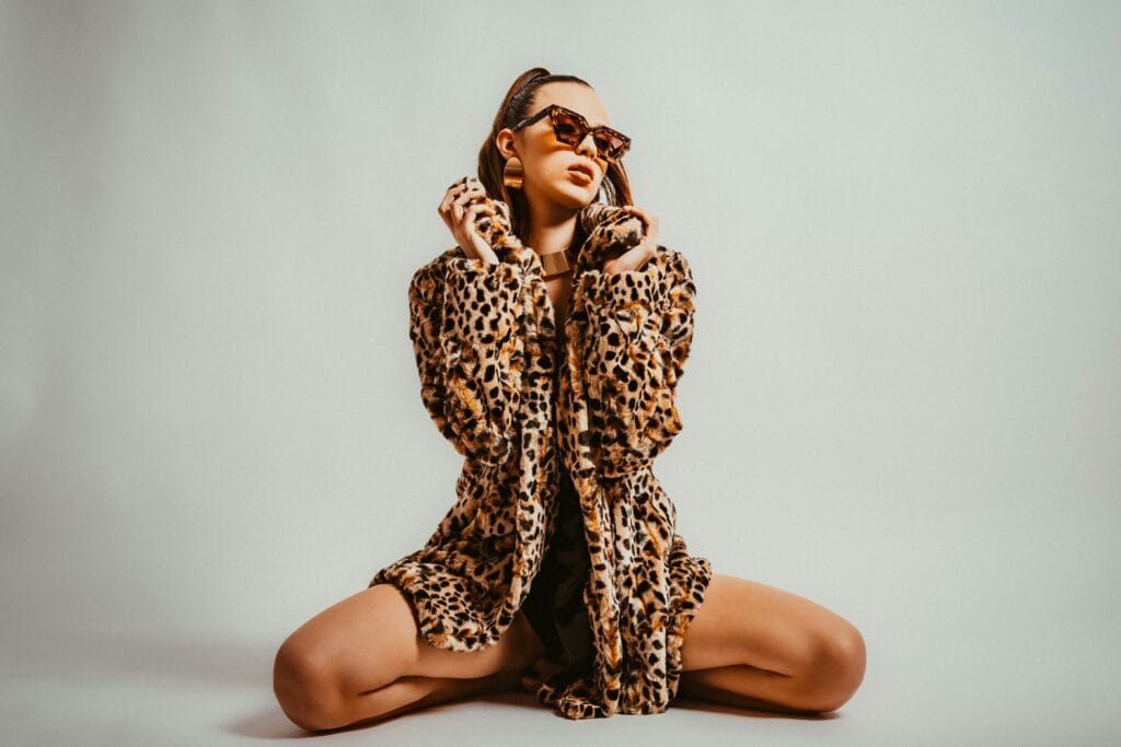 Woman wearing a leopard print outfit, illustrating how to wear animal print outfits in an animal print styling guide.