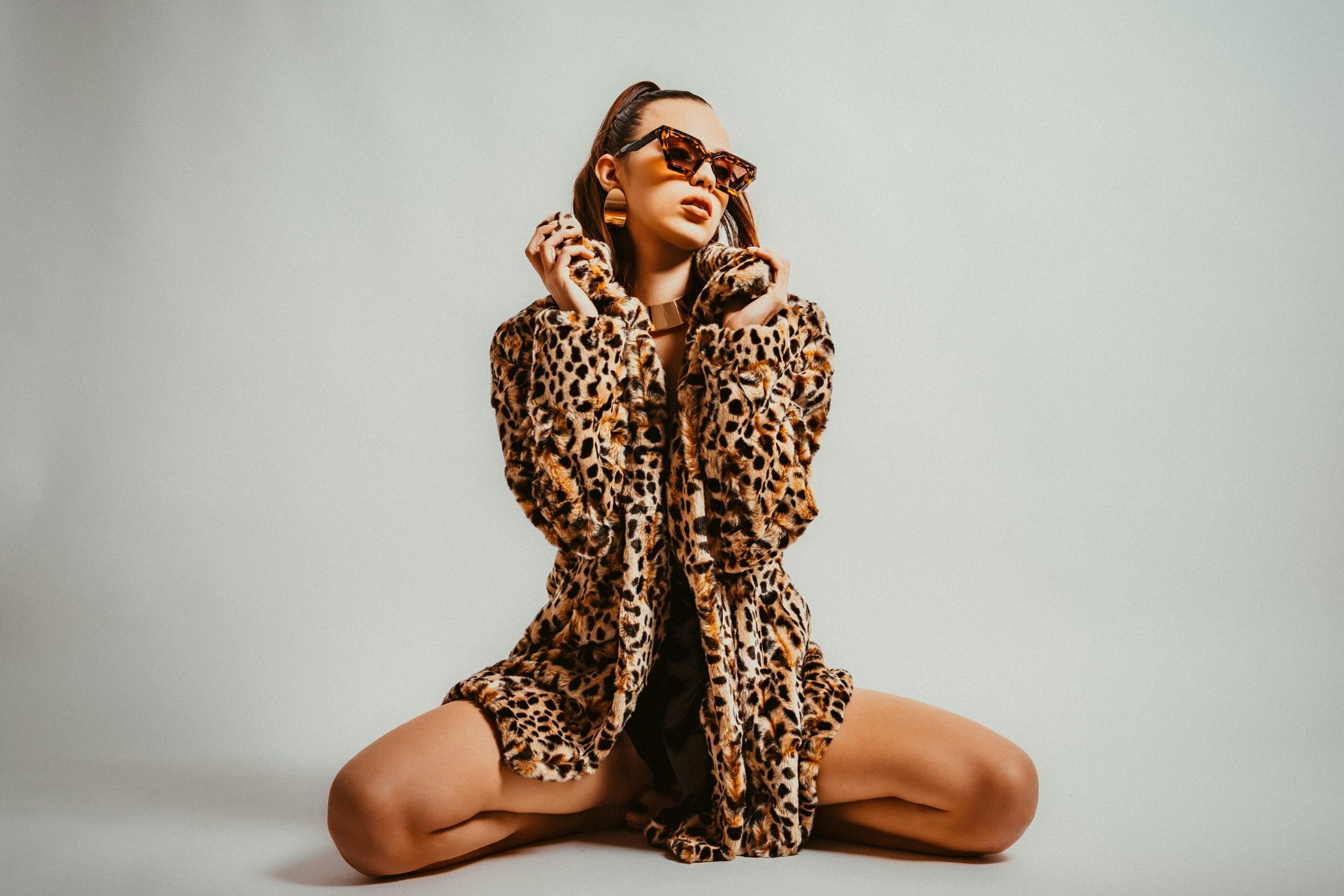 Woman wearing a leopard print outfit, illustrating how to wear animal print outfits in an animal print styling guide.